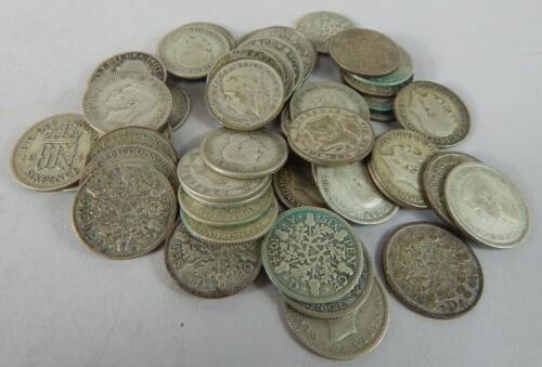 Fifty pre-1946 six pence coins