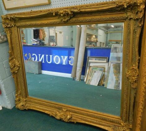 A modern gilt wall mirror