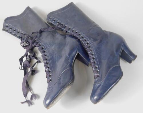 A pair of blue leather vintage style size five ladies lace up high heel boots.