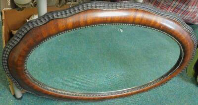 An early 20thC simulated wood gesso oval mirror