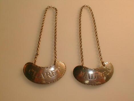 A pair of George III silver decanter labels