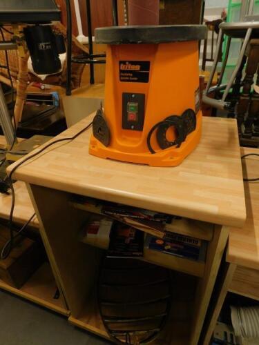 A Triton electric oscillating spindle sander and two metal stable hay storage racks and a stand