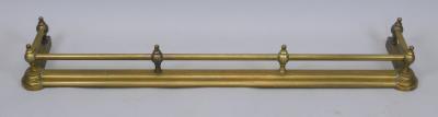 An early 19thC brass fire curb or fender