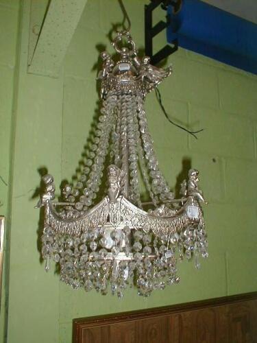 A reproduction plated chandelier with cherubs and cut crystal drops