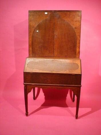 A Continental oak and burr walnut veneered cabinet bureau