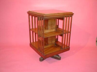 A late Victorian walnut revolving bookcase