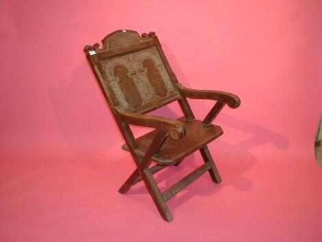 A carved oak Glastonbury chair