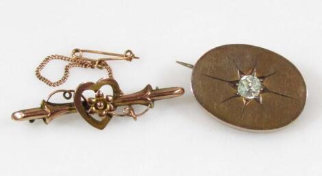 Two gold brooches.