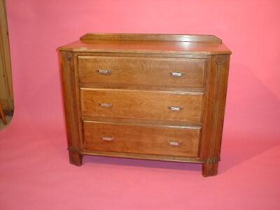 An oak three drawer chest