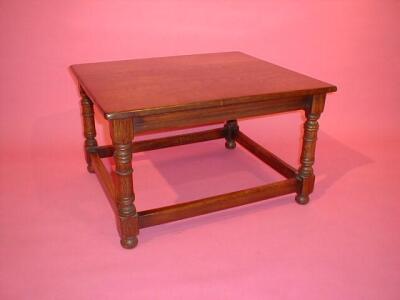 A reproduction oak coffee table