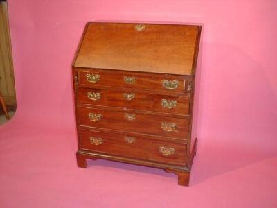 A 19thC mahogany bureau with fall flap revealing a fitted interior over