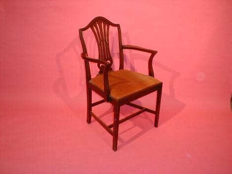 A set of four mahogany carver chairs in the Hepplewhite manner