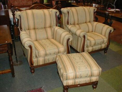 A pair of reproduction Regency deep upholstered armchairs and matching footstool