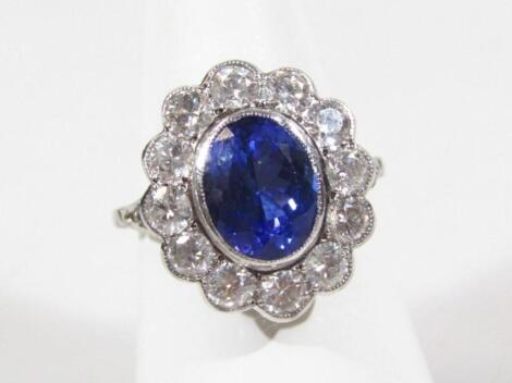 A sapphire and diamond floral cluster ring