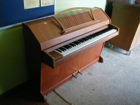 An Eavestaff Mini Royal piano