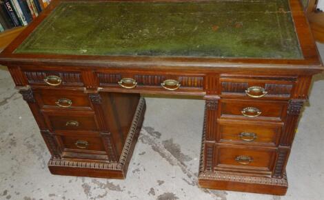 A late 19thC walnut twin pedestal writing desk