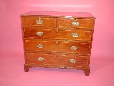 A George III mahogany chest of two short and three long graduated drawers