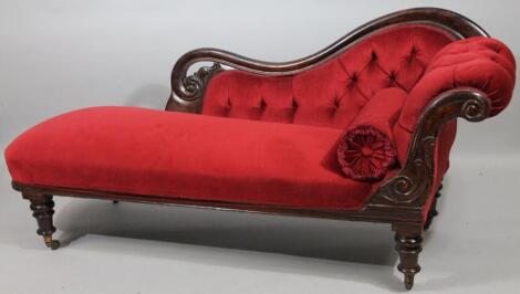 A Victorian stained oak chaise longue