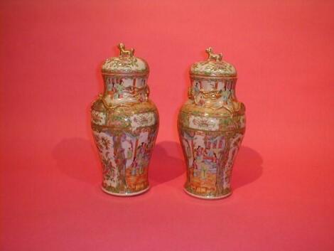 A pair of 19thC Cantonese baluster vases with covers