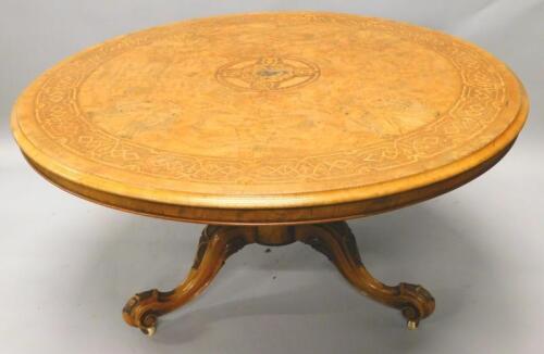 A Victorian figured walnut circular dining table