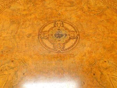 A Victorian figured walnut circular dining table - 2