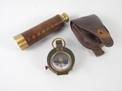 A brass military compass, No 48121, in a leather pouch, and a Capris three draw telescope, (2).