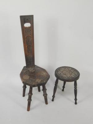 An early 20thC ebonised and chip carved spinning chair