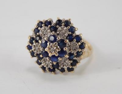 A 9ct gold sapphire and diamond flower head ring