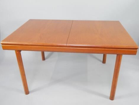 A retro style teak extending dining table