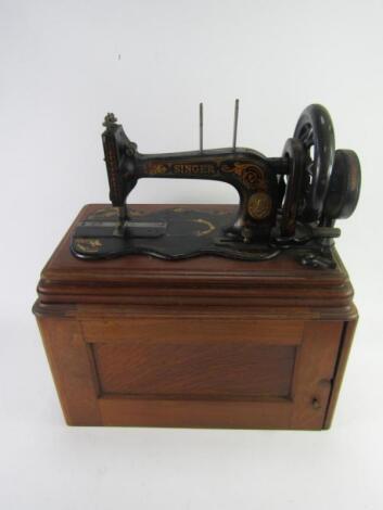 A Singer 12K fiddle sewing machine