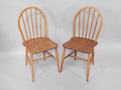 A pair of Ercol type stick back kitchen chairs