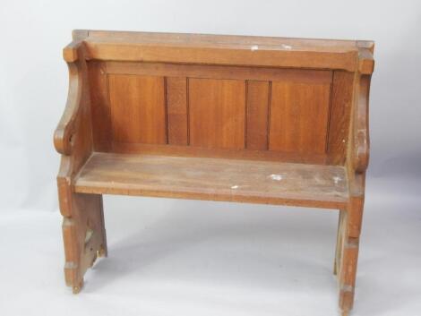 A small oak Gothic style church pew