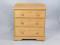 A pine chest of three graduated drawers