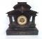 A 19thC slate mantel clock of architectural form