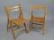 A pair of beech folding chairs