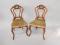 A pair of Victorian walnut shield back bedroom chairs