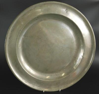 An early 18thC large plain rimmed pewter dish by John Aughton