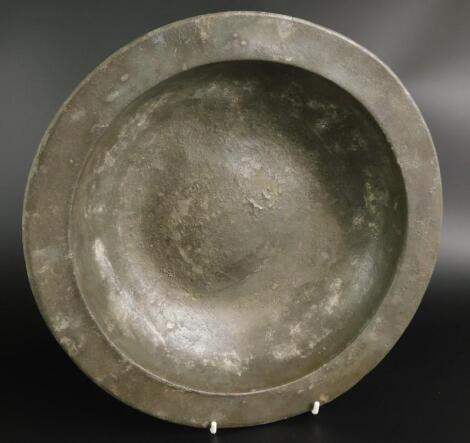 A 16thC excavated bossed pewter bowl