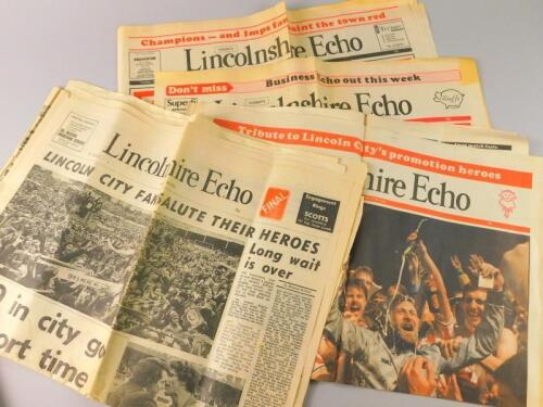 A selection of coloured football newspapers