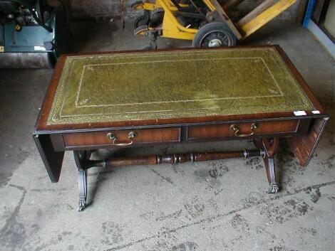 A reproduction mahogany sofa table