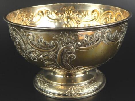 An early 20thC embossed silver rose bowl