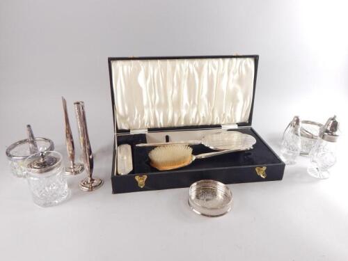 A silver mounted dressing table set