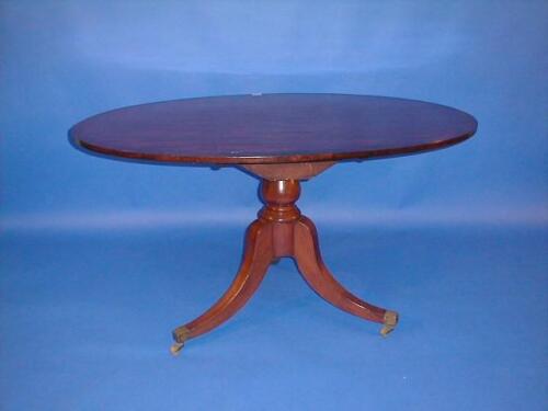 A 19thC mahogany snap top table with cross banded oval top