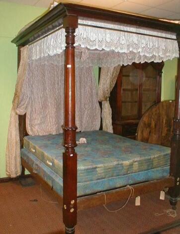 A Victorian mahogany four poster bed