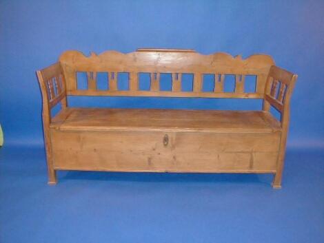 A stripped pine bench with box seat