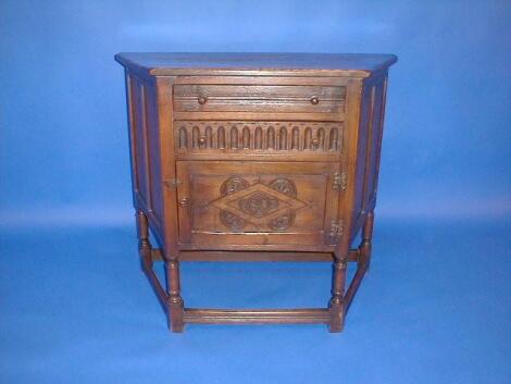 A reproduction oak credenza