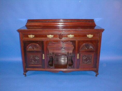 An Edwardian mahogany sideboard