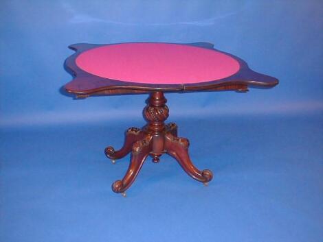 A Victorian mahogany serpentine card table with fold-over top