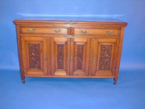 A late Victorian carved walnut dresser base