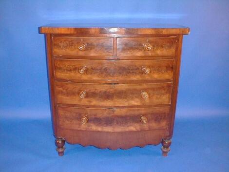 A Victorian flamed mahogany bow front chest of two short and three long